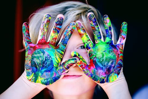 boy with colored hands